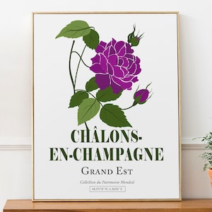 Op de afbeelding: Een witte poster met een paarse roos en groene bladeren. De tekst op de poster luidt "CHALONS-EN-CHAMPAGNE GRAND EST Collection du Patrimoine Mondial 48.9574 N. 4.3636" E.
