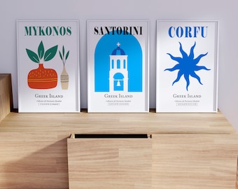 May include: Three framed posters with white backgrounds and colorful illustrations. The posters are titled "Mykonos", "Santorini", and "Corfu" and feature a vase with plants, a church, and a sun, respectively. Each poster includes the text "Greek Island" and "Collezione del Patrimonio Mondiale".