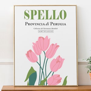 Może przedstawiać: Biały plakat w złotej ramie przedstawiający r&oacute;żową ilustrację kwiatową tulipan&oacute;w. Plakat zawiera tekst "SPELLo" zielonymi literami i "PROVINCIA di PERUGIA" czarnymi literami. Tekst "Collezione del Patrimonio Mondiale" i "42.9877&deg; N 12.6712&deg; E" r&oacute;wnież jest zawarty czarnymi literami.