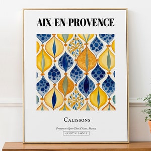 Puede incluir: Una impresión enmarcada con un patrón geométrico de formas de lágrima amarillas, azules y verdes. La impresión tiene el texto "AIX-EN-PROVENCE" en la parte superior y "CALISSONS" en la parte inferior, junto con la ubicación "Provenza-Alpes-Costa Azul, Francia" y las coordenadas "43.5297 N 5.4474 E".