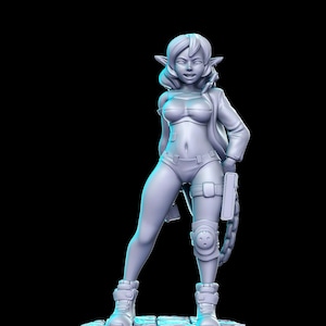 May include: A gray 3D printed figurine of a female elf character. She is wearing a dark top, shorts, and knee pads. She is holding a gun in one hand and a chain with a book attached to it in the other. She is standing on a circular base with a cobblestone design.