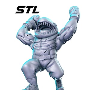 May include: A gray 3D printed figurine of a muscular shark wearing boxing gloves and shorts. The shark has a wide open mouth with sharp teeth and is in a fighting pose.