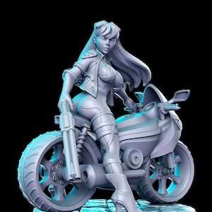 May include: A detailed figurine of a woman in a futuristic biker outfit, posed with a motorcycle and a large gun. The figure is in a light gray color, with intricate details on the clothing and the motorcycle. The background is black.