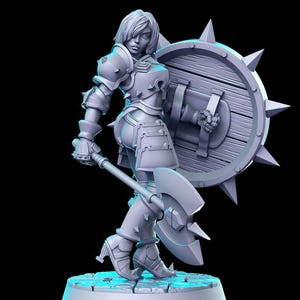 May include: A gray 3D printed miniature of a female warrior figure holding a large axe and a spiked shield. The figure is wearing armor and has a determined expression on her face.