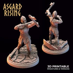May include: A 3D printed miniature of a female warrior holding a double-headed axe. The miniature is standing on a broken wooden base. The miniature is painted in a light brown color. The text "ASSGARD RISING" is visible in the background.