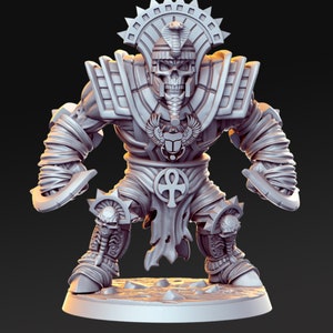 May include: A gray, detailed miniature figurine of a skeletal warrior wearing a headdress with a cobra, a loincloth with an ankh symbol, and bandages. The warrior is holding two curved blades.