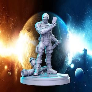 May include: A white painted figurine of a superhero holding a playing card. The figurine is standing on a round base with a textured surface. The background is a blurry image of a planet with a blue and orange sky.