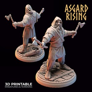 May include: Two 3D printed miniatures of hooded figures holding axes. The figures are standing on round bases with rope details. The text "Asgard Rising" is visible in the background.