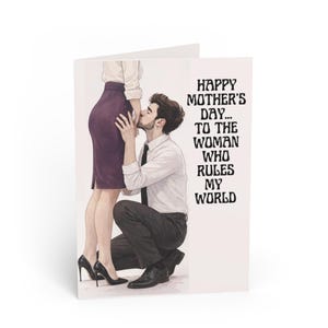 May include: A greeting card with the text "HAPPY MOTHER'S DAY... TO THE WOMAN WHO RULES MY WORLD." The illustration depicts a man kneeling and kissing a woman's leg. The woman wears a purple skirt and black heels.