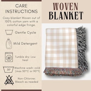 May include: Woven blanket with a beige and white checkered pattern. The blanket has a black fringe on one side and a colorful fringe on the other. The care instructions are displayed on the left side of the image.