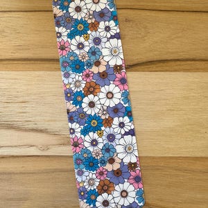 May include: A set of three ceramic mugs with a speckled, matte finish. The mugs are in shades of cream, light gray, and dark gray. Each mug has a simple, minimalist design, perfect for coffee or tea.