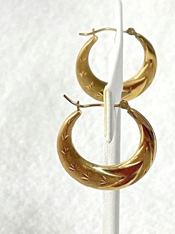 Vintage 14K gold hollow hoop earrings.