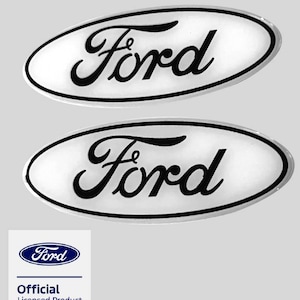 May include: Two oval-shaped emblems featuring the black Ford script logo on a white background with a thin black border. Below the emblems is a square white graphic containing the blue Ford logo and the text Official Licensed Product.