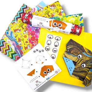 Pode incluir: Um conjunto de papel de origami colorido com tema de c&atilde;es. O papel &eacute; impresso com v&aacute;rios padr&otilde;es, incluindo bolinhas, listras e um design de m&aacute;rmore. O conjunto tamb&eacute;m inclui uma folha de olhos de cachorro e uma folha de instru&ccedil;&otilde;es para fazer um cachorro de origami.