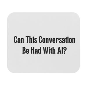 May include: A white, rounded-corner square coaster with the text "Can This Conversation Be Had With AI?" in black, bold font. The coaster is a simple, minimalist design.