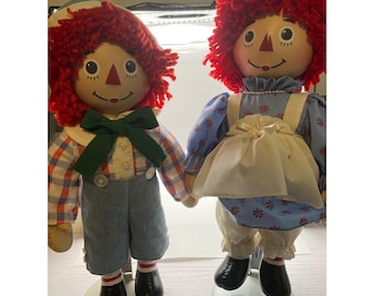 The Brass Key Raggedy Ann and Andy Porcelain Head Dolls with Stands Set of 2