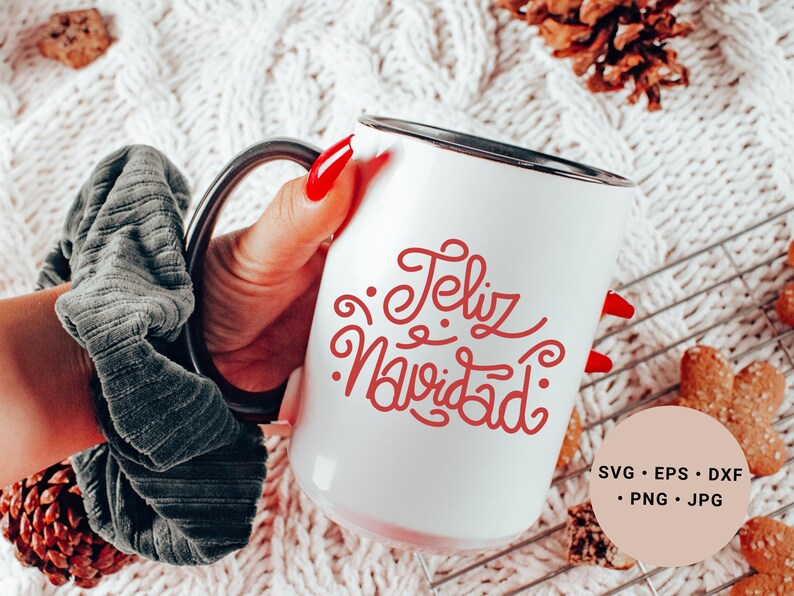 May include: White ceramic mug with a black rim and handle. The mug has red cursive text that says "Feliz Navidad".