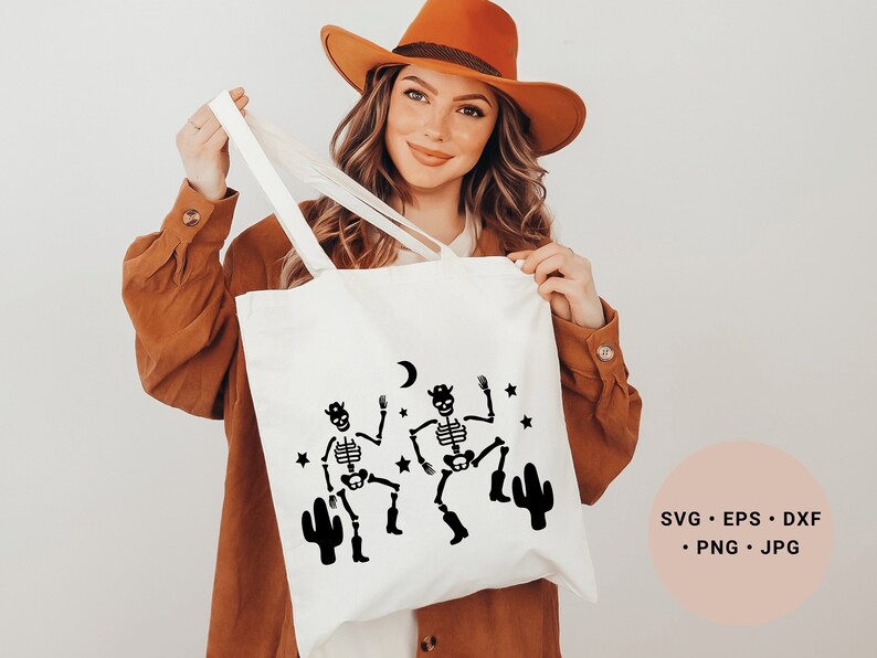 May include: White tote bag with a black design of two skeletons dancing with cacti and a crescent moon. The text "SVG - EPS - DXF - PNG - JPG" is on a pink background.