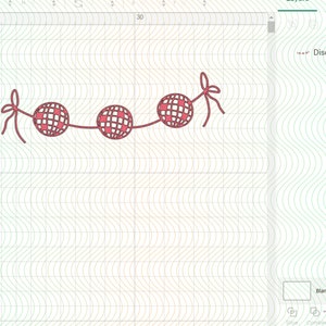 May include: A string of three red and white disco balls with red bows on each end.
