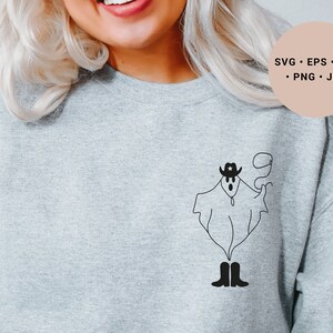 May include: A gray sweatshirt with a black and white illustration of a ghost wearing a cowboy hat and boots. The ghost is holding a lasso in its hand.