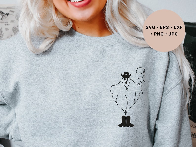 May include: A gray sweatshirt with a black and white illustration of a ghost wearing a cowboy hat and boots. The ghost is holding a lasso in its hand.