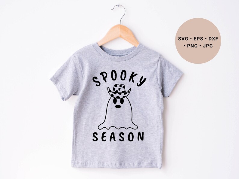 May include: A gray t-shirt with a black and white ghost wearing a cowboy hat and the text "Spooky Season".