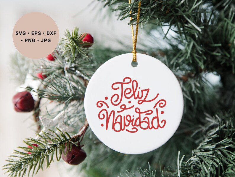May include: White ceramic Christmas ornament with red lettering that says "Feliz Navidad".
