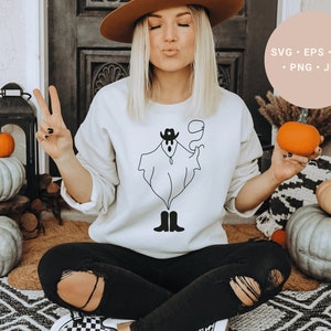 May include: A white sweatshirt with a black line drawing of a ghost wearing a cowboy hat and boots. The ghost is holding a lasso. The text "SVG - EPS - DXF - PNG - JPG" is in the upper right corner of the image.