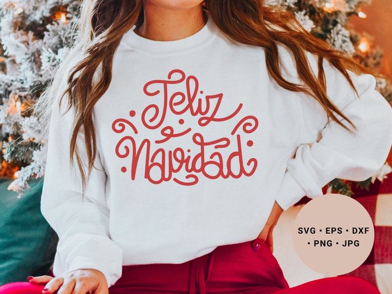 May include: White sweatshirt with red lettering that says "Feliz Navidad".