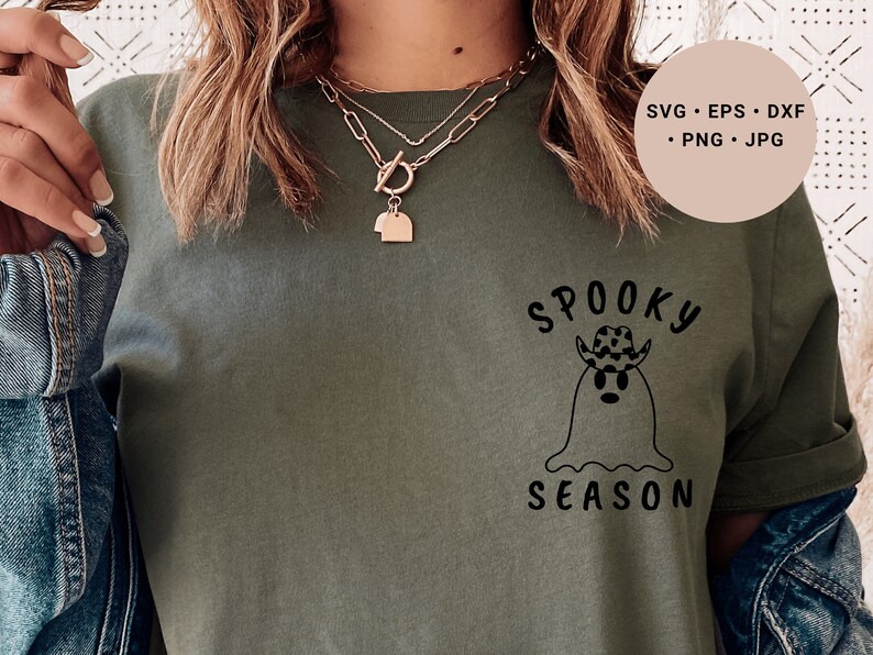 May include: A green t-shirt with a black graphic of a ghost wearing a cowboy hat and the text "Spooky Season".