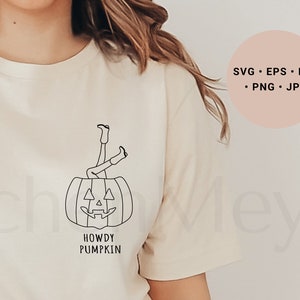 May include: A white t-shirt with a black line drawing of a person's legs sticking out of a jack-o'-lantern. The text "Howdy Pumpkin" is below the image.