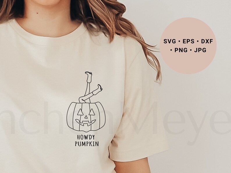 May include: A white t-shirt with a black line drawing of a person's legs sticking out of a jack-o'-lantern. The text "Howdy Pumpkin" is below the image.