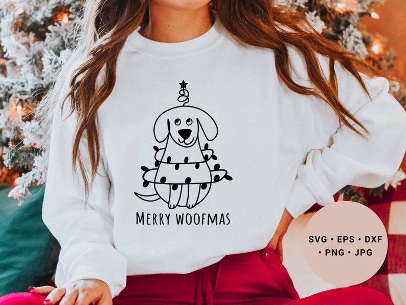 May include: White sweatshirt with a black and white illustration of a dog wearing Christmas lights and the text "Merry Woofmas".