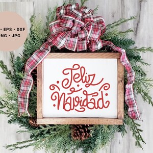 May include: A white wooden sign with the text "Feliz Navidad" in red cursive lettering. The sign is decorated with a red and white plaid bow and green pine branches.