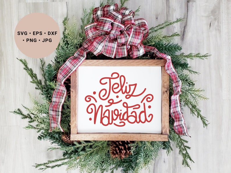 May include: A white wooden sign with the text "Feliz Navidad" in red cursive lettering. The sign is decorated with a red and white plaid bow and green pine branches.