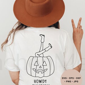 May include: White t-shirt with a black line drawing of a pumpkin with legs sticking out of the top. The text "Howdy Pumpkin" is below the pumpkin.