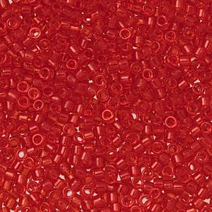 May include: Close-up of a pile of small, translucent red seed beads. The beads are cylindrical with a hole running through the center, and they are scattered randomly, creating a textured surface. The beads are a vibrant, transparent red.