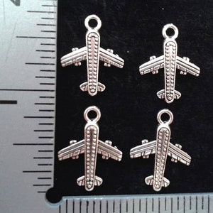 4 COMMERCIAL AIRLINER  CHARMS. Antique Silver .  2 Pairs.