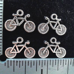 4 BICYCLE  CHARMS .Antique Silver.2 Pairs