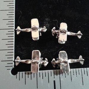 4 VINTAGE AIRPLANE   CHARMS. Antique Silver Bi Plane 2 Pairs.
