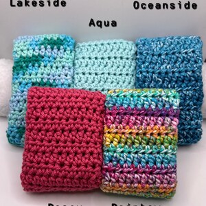 May include: Five crocheted dishcloths in different colors and patterns. The dishcloths are labeled "Lakeside", "Aqua", "Oceanside", "Rosey", and "Rainbow".