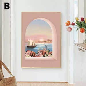 May include: A pink framed canvas print with a view of a sailboat on the water with a city skyline in the distance. The view is framed by a pink archway with flowers in the foreground.