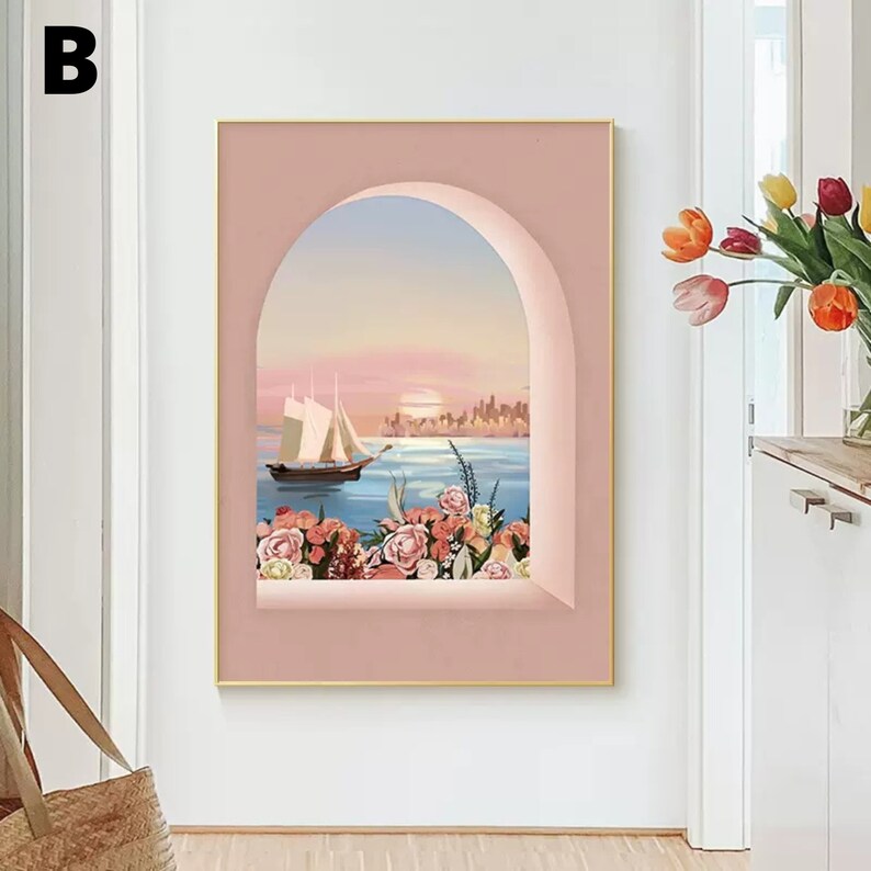 May include: A pink framed canvas print with a view of a sailboat on the water with a city skyline in the distance. The view is framed by a pink archway with flowers in the foreground.