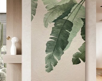 May include: A rectangular wall art piece featuring a textured, off-white background with large, overlapping banana leaves painted in varying shades of deep forest green and muted sage green, showcasing visible brushstrokes and a thick impasto texture.