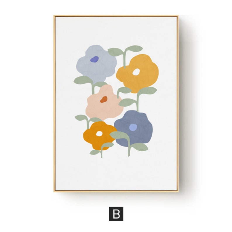 May include: A framed floral art print featuring stylized flowers in shades of blue, orange, and pink against a white background. The flowers have green stems and leaves. The frame is gold-colored, and the print has a modern, minimalist aesthetic.