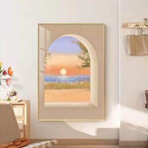 May include: A painting of a sunset over the ocean seen through an arched window. The sky is a gradient of blue, purple, and orange, with a bright orange sun in the center. The ocean is a deep blue, with whitecaps and a reflection of the sun. The beach is a light brown, with green grass and flowers in the foreground.
