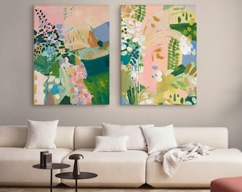 May include: Two rectangular canvas wall art pieces featuring abstract botanical compositions. The paintings display a vibrant palette of pink, forest green, sage, teal, and yellow, with layered brushstrokes forming organic shapes and floral-like patterns.