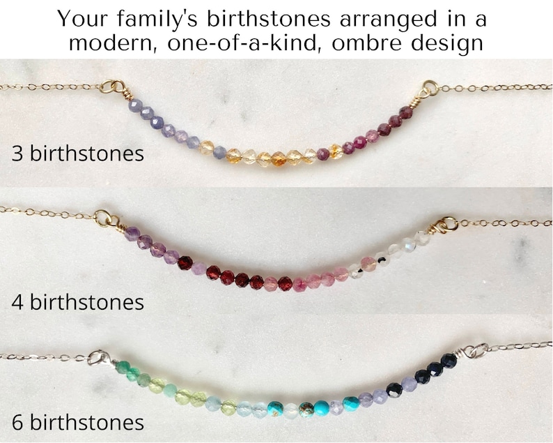 May include: Three gold necklaces with birthstones arranged in an ombre design. The top necklace has three birthstones, the middle necklace has four birthstones, and the bottom necklace has six birthstones.