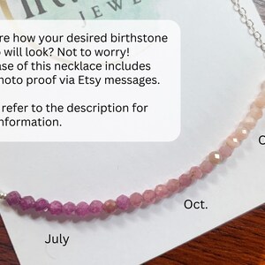 May include: A close-up of a necklace with pink and red beads. The beads are arranged in a gradient from pink to red. The necklace is labeled "July" and "Oct." on either side of the gradient.
