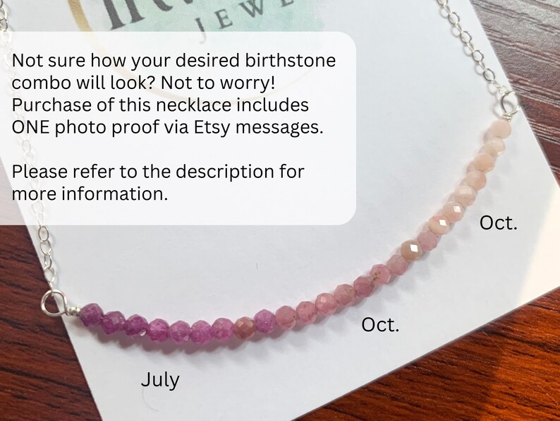 May include: A close-up of a necklace with pink and red beads. The beads are arranged in a gradient from pink to red. The necklace is labeled "July" and "Oct." on either side of the gradient.